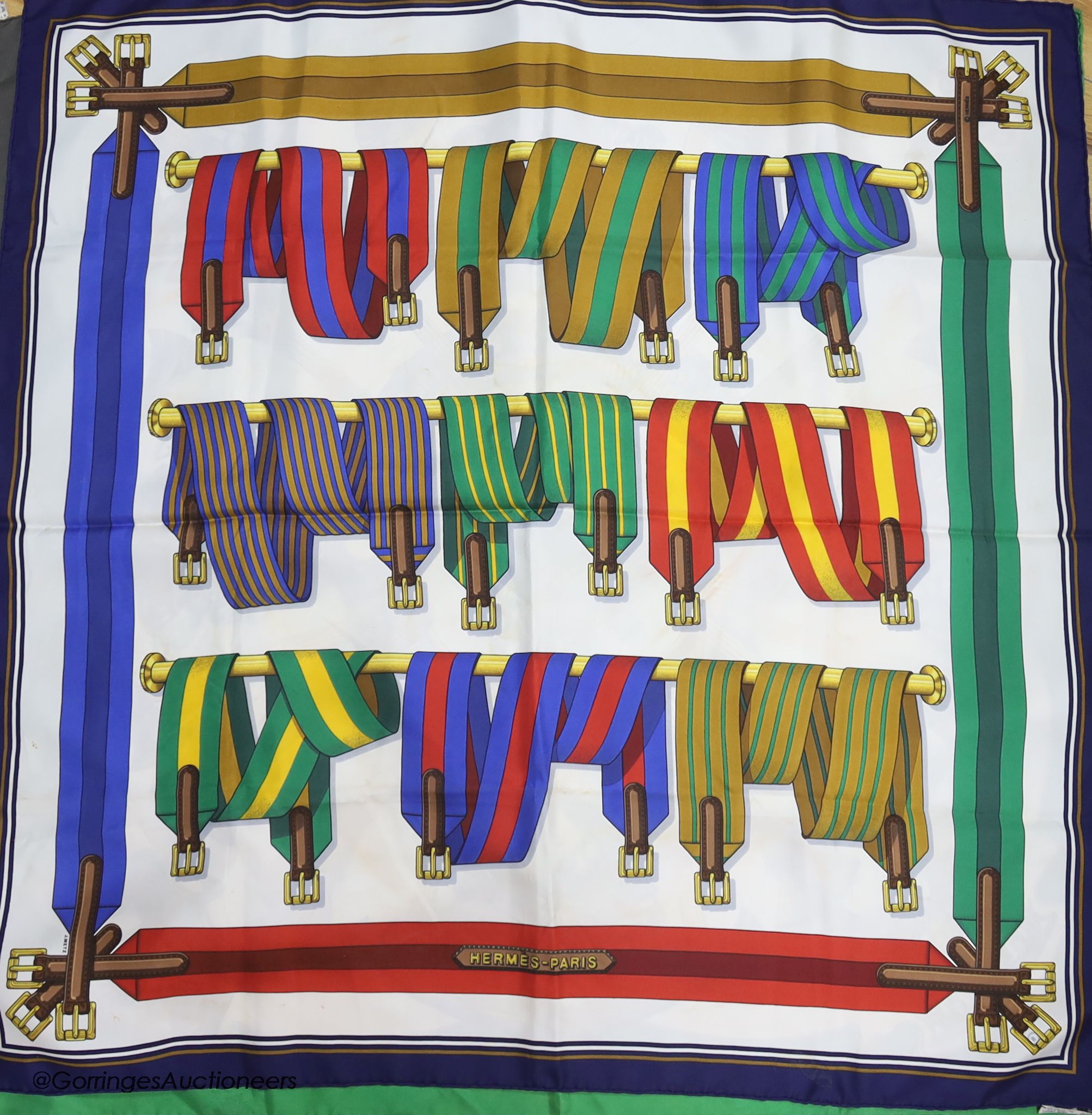 Three vintage Hermes silk scarves, 'Scarabee et Pectoraux' (gold, green, white), 'Carrousel' (green ground), and 'Sangles' (multi)